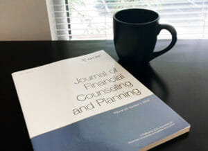 Journal and coffee cup